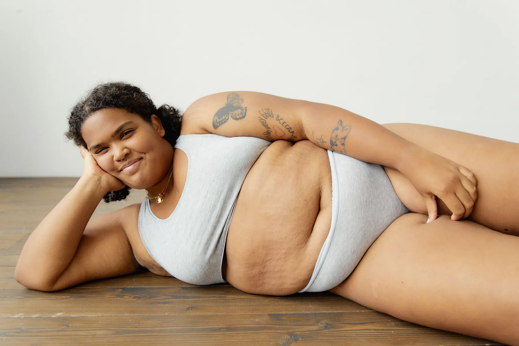 Confident woman in comfortable grey underwear